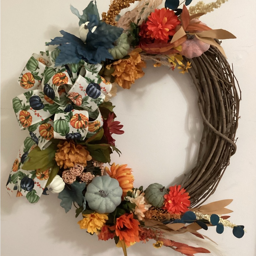 Orange and Green Holiday Wreath with Floral Accents